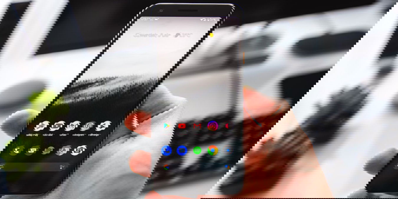 Person using their phone to control a Windows PC with an Android device.