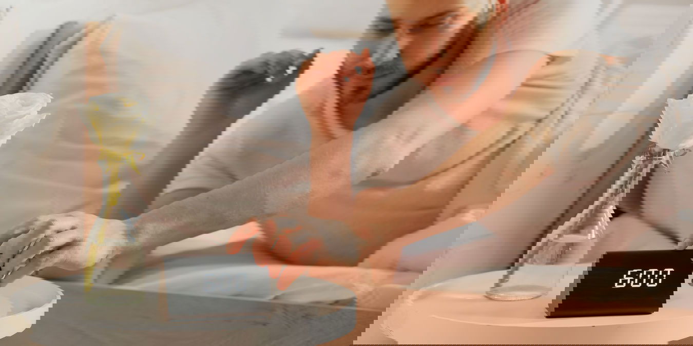 Man Using Smart Alarm Clock Wake Up